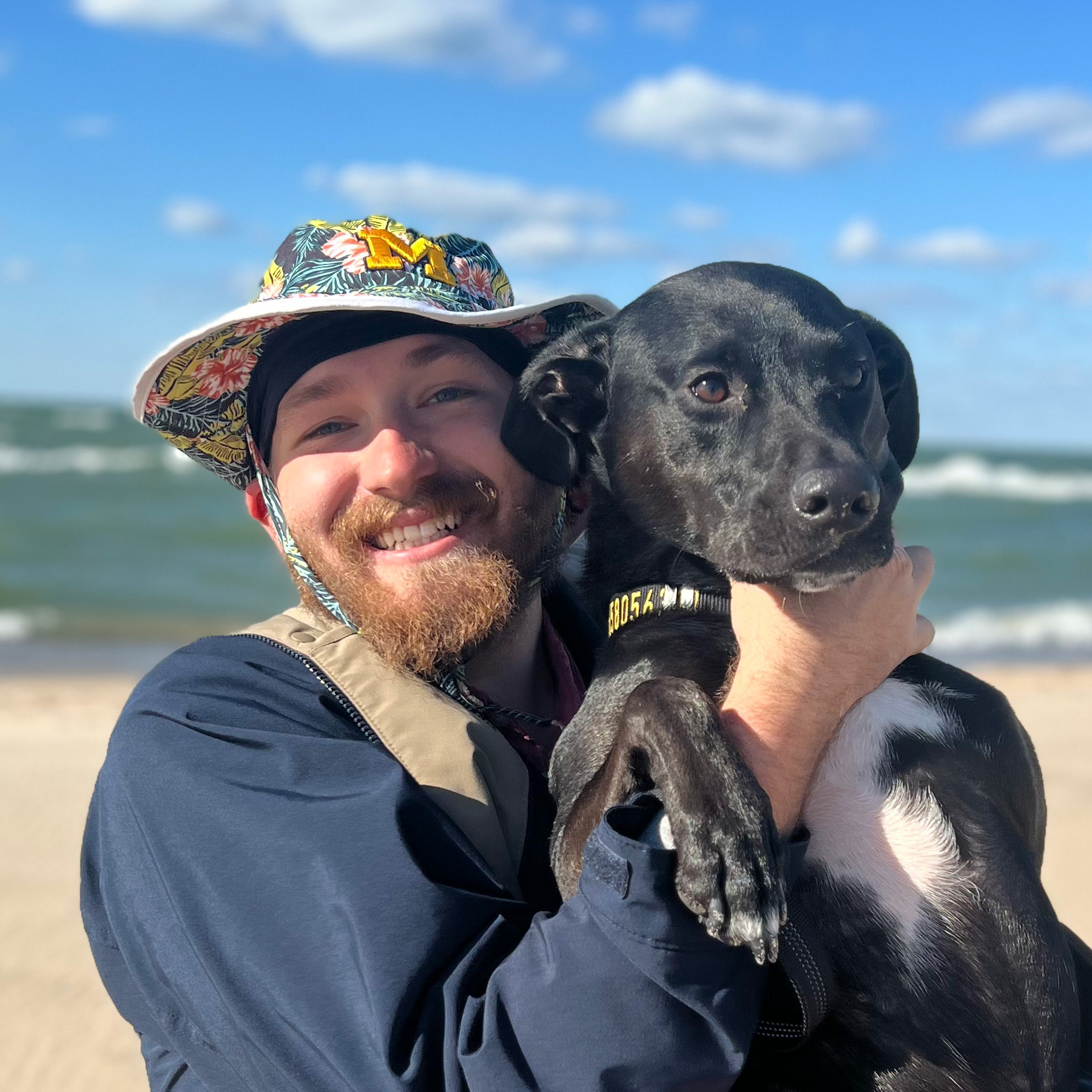 Gregory and his dog, Linux, at the beach